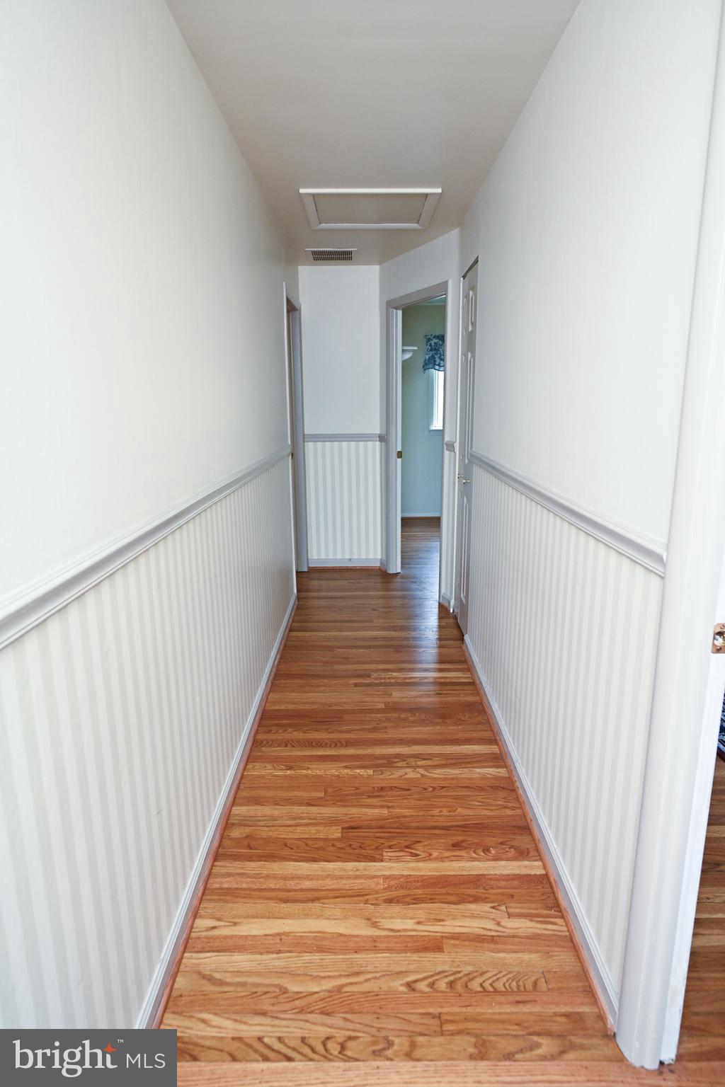 1713 Red Oak Road Williamstown, NJ 08094 - Photo 43 of 76 a view of a hallway with wooden floor and entryway