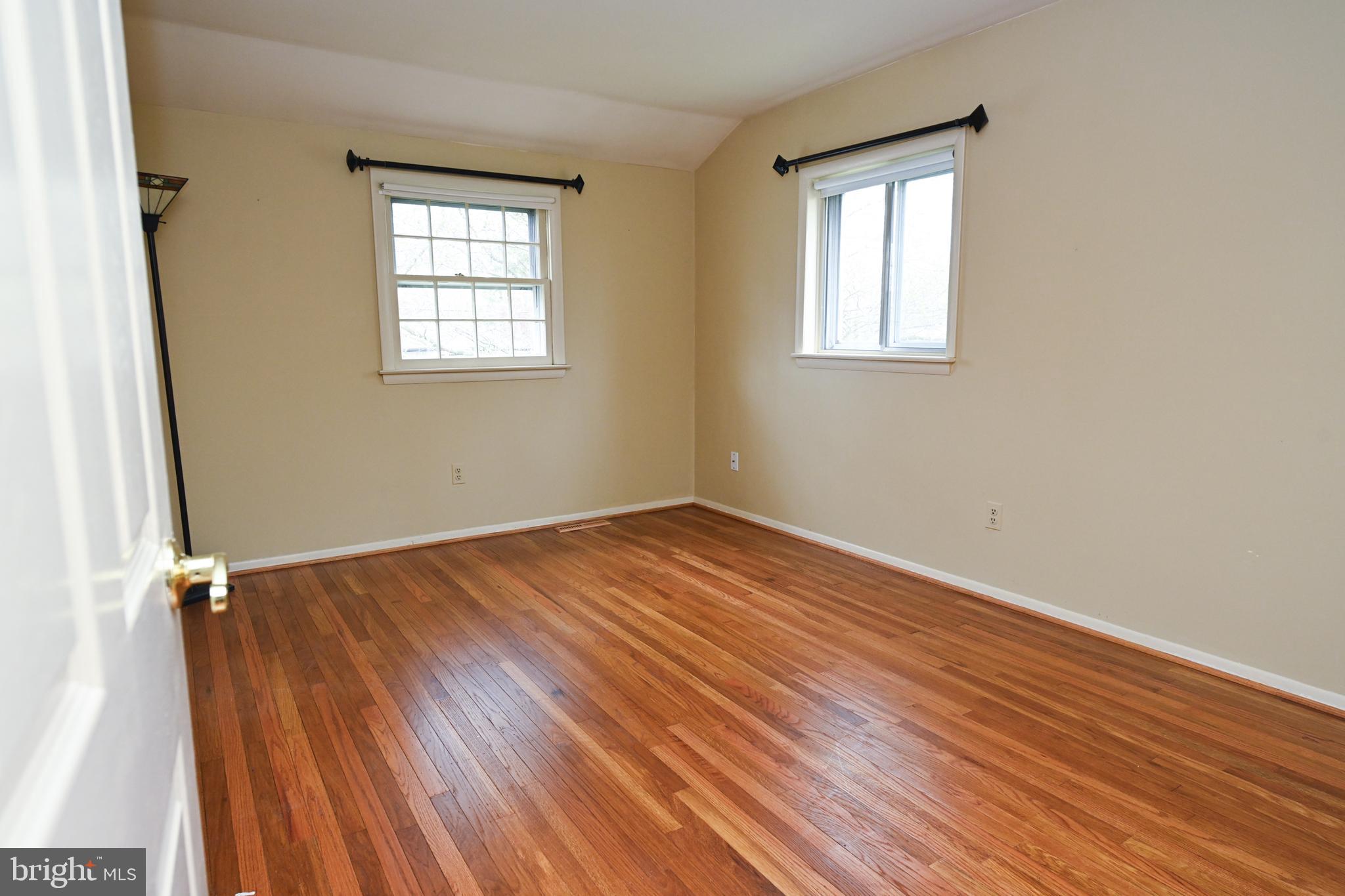 1713 Red Oak Road Williamstown, NJ 08094 - Photo 46 of 76 an empty room with wooden floor and windows