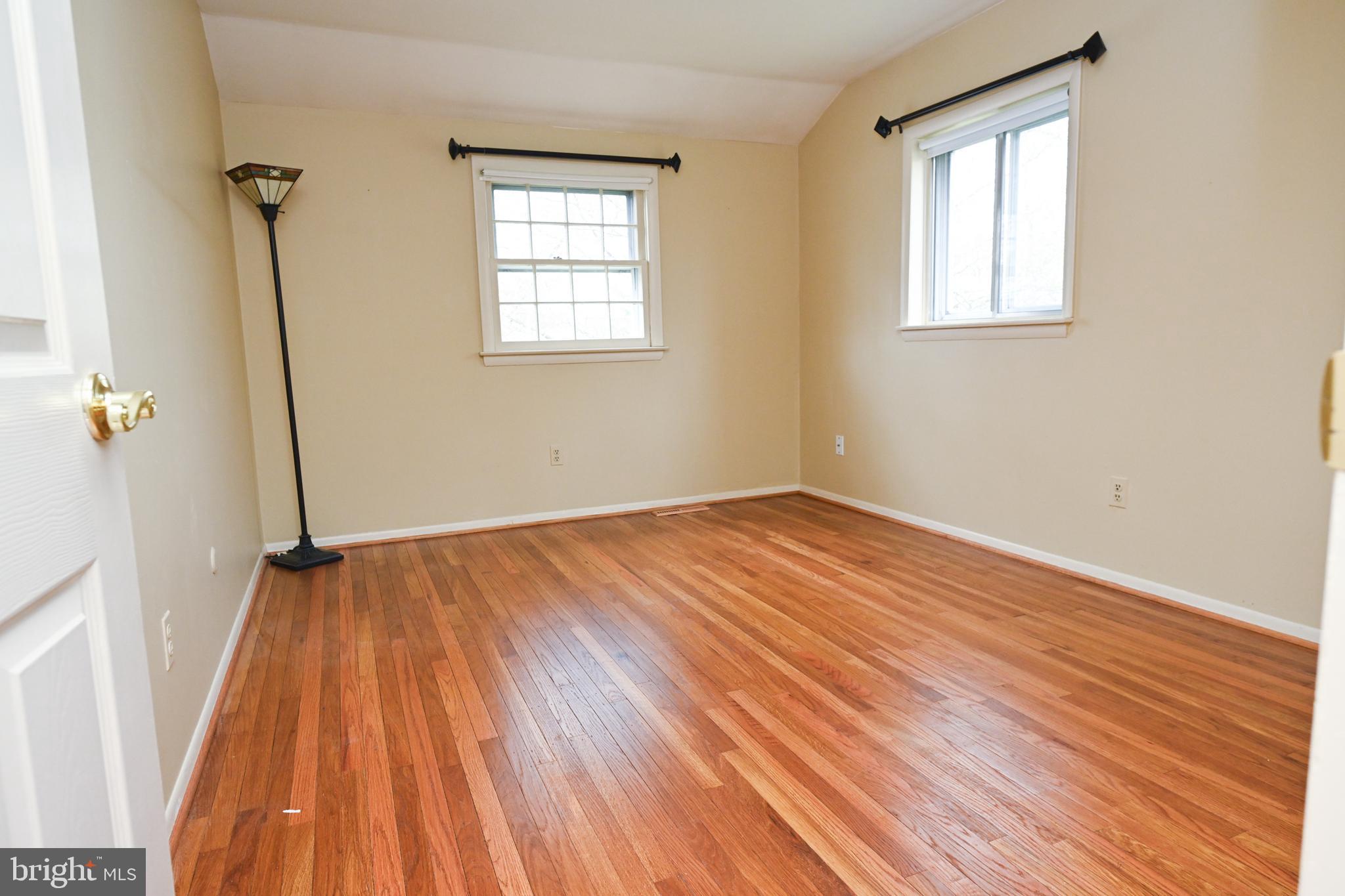 1713 Red Oak Road Williamstown, NJ 08094 - Photo 47 of 76 an empty room with wooden floor and windows