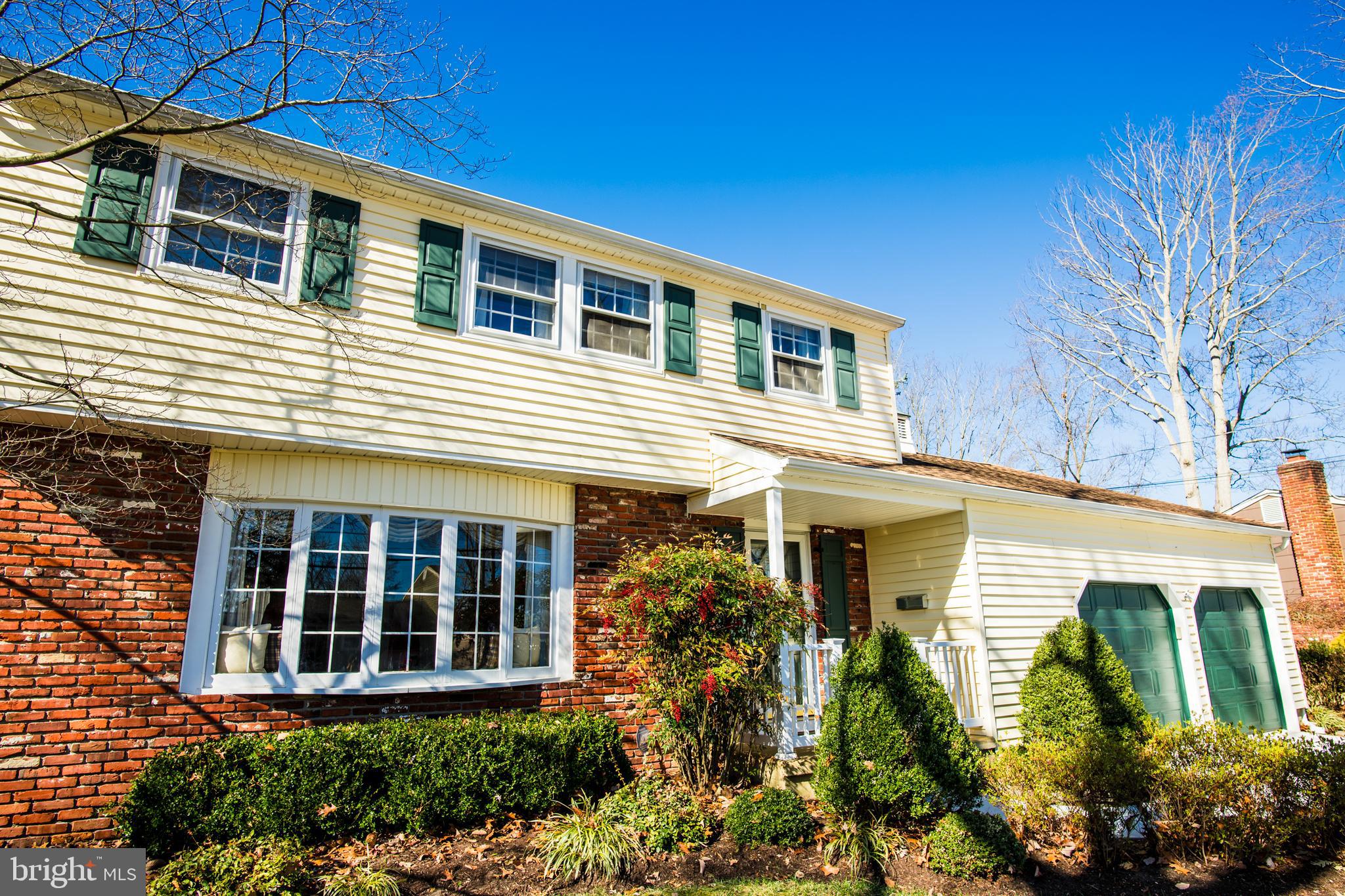 1713 Red Oak Road Williamstown, NJ 08094 - Photo 70 of 76 a front view of a house with a garden