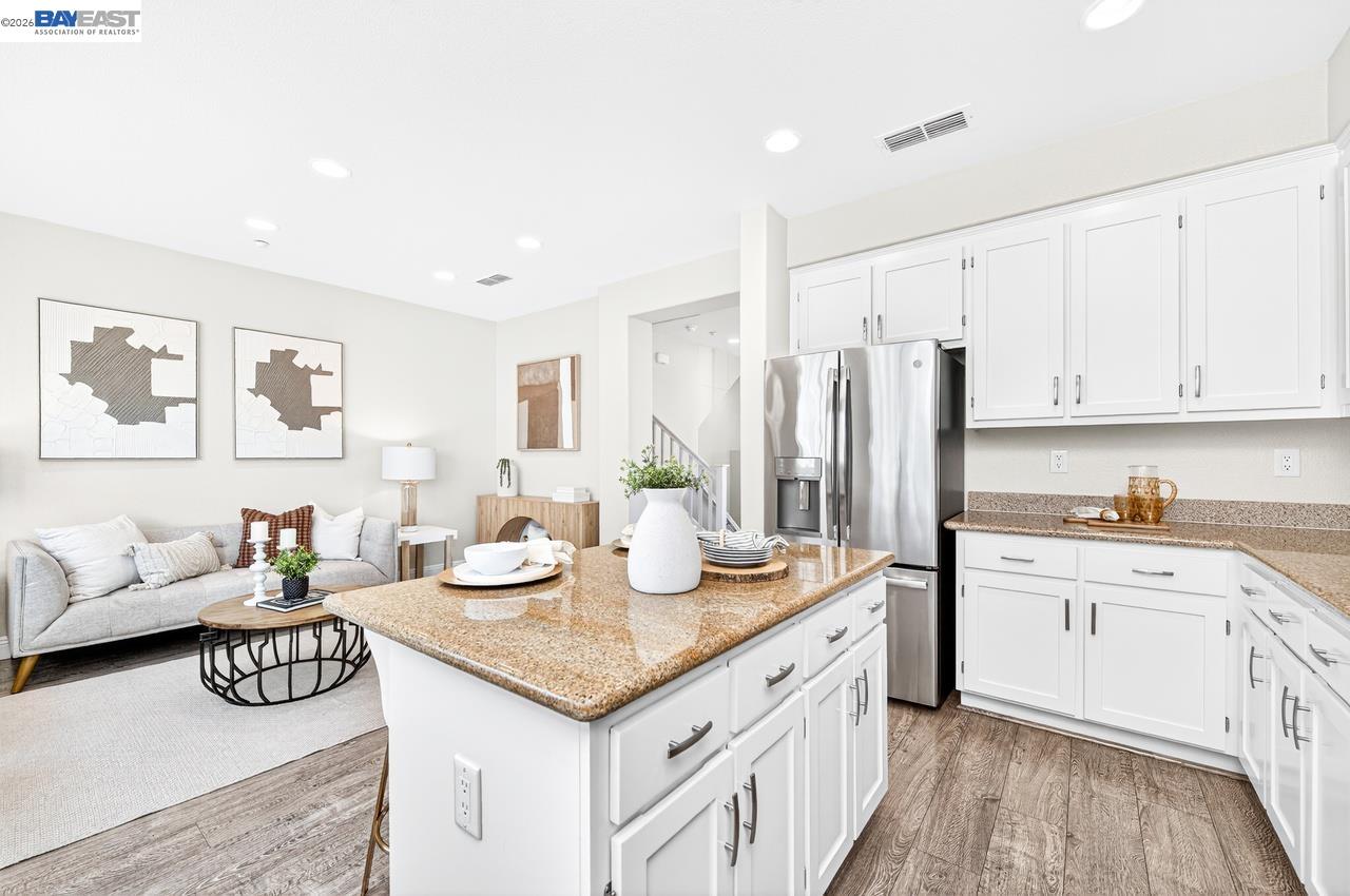 2871 First Street, Unit 901 Livermore, CA 94550 - Photo 17 of 46 a open kitchen with stainless steel appliances granite countertop a sink stove and refrigerator