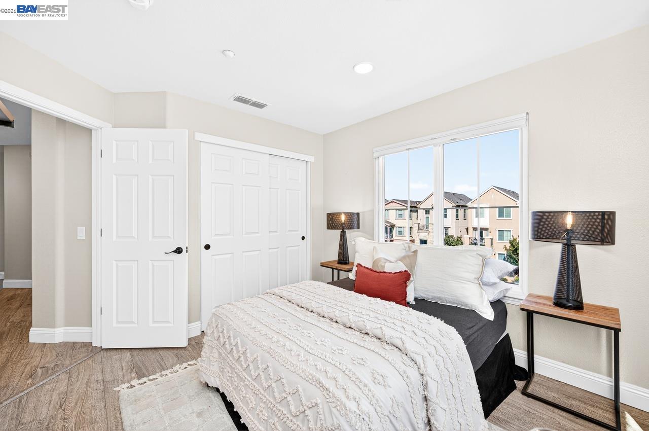 2871 First Street, Unit 901 Livermore, CA 94550 - Photo 31 of 46 a bedroom with a bed and a lamp
