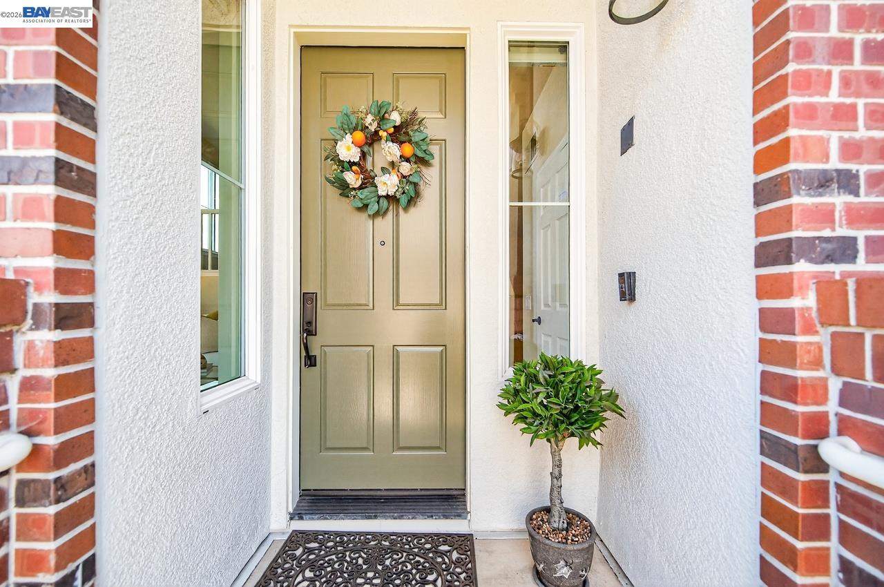 2871 First Street, Unit 901 Livermore, CA 94550 - Photo 4 of 46 a view of a hallway with wooden floor and a potted plant