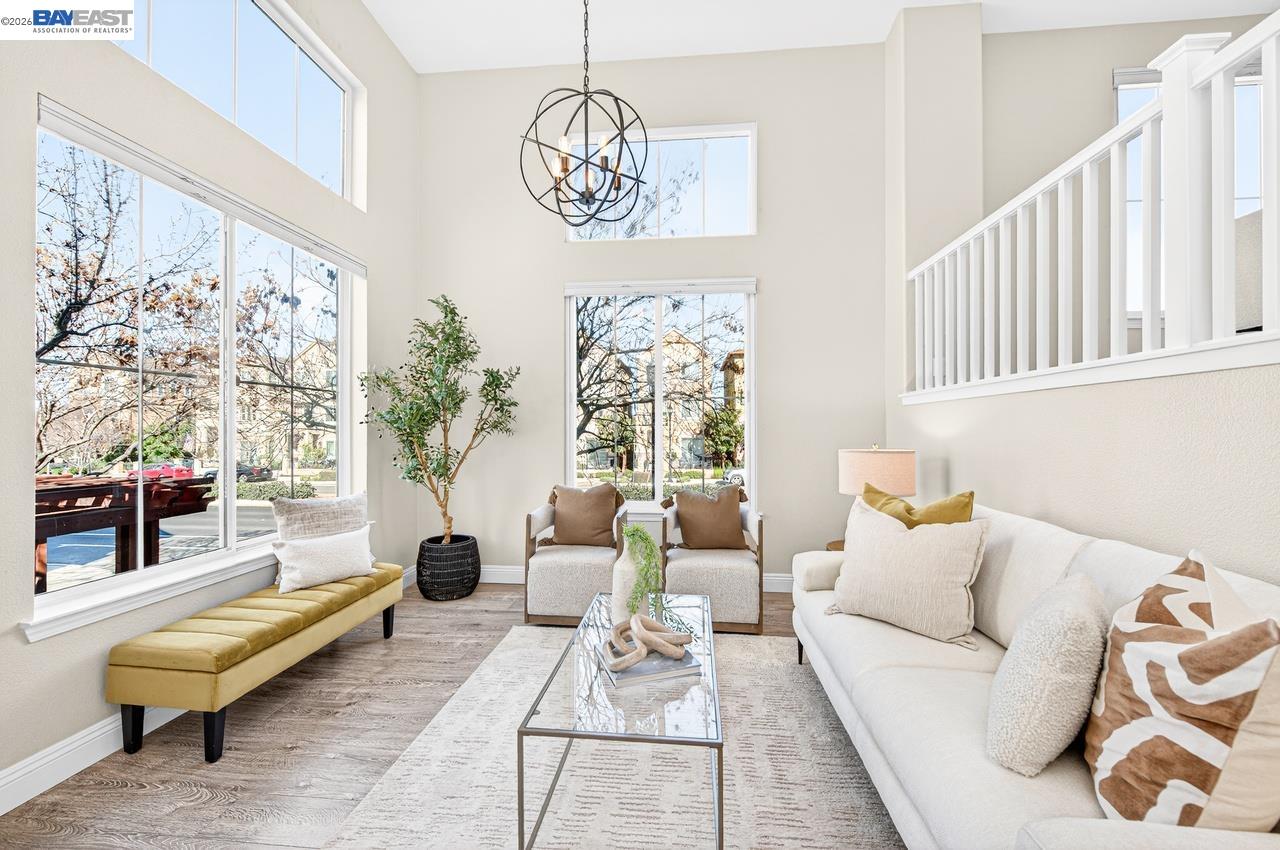 2871 First Street, Unit 901 Livermore, CA 94550 - Photo 7 of 46 a living room with furniture a chandelier and a table