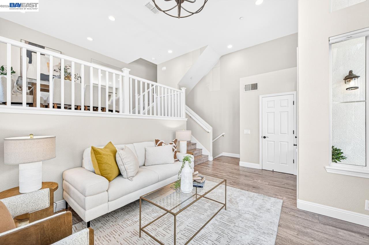 2871 First Street, Unit 901 Livermore, CA 94550 - Photo 8 of 46 a living room with furniture and wooden floor