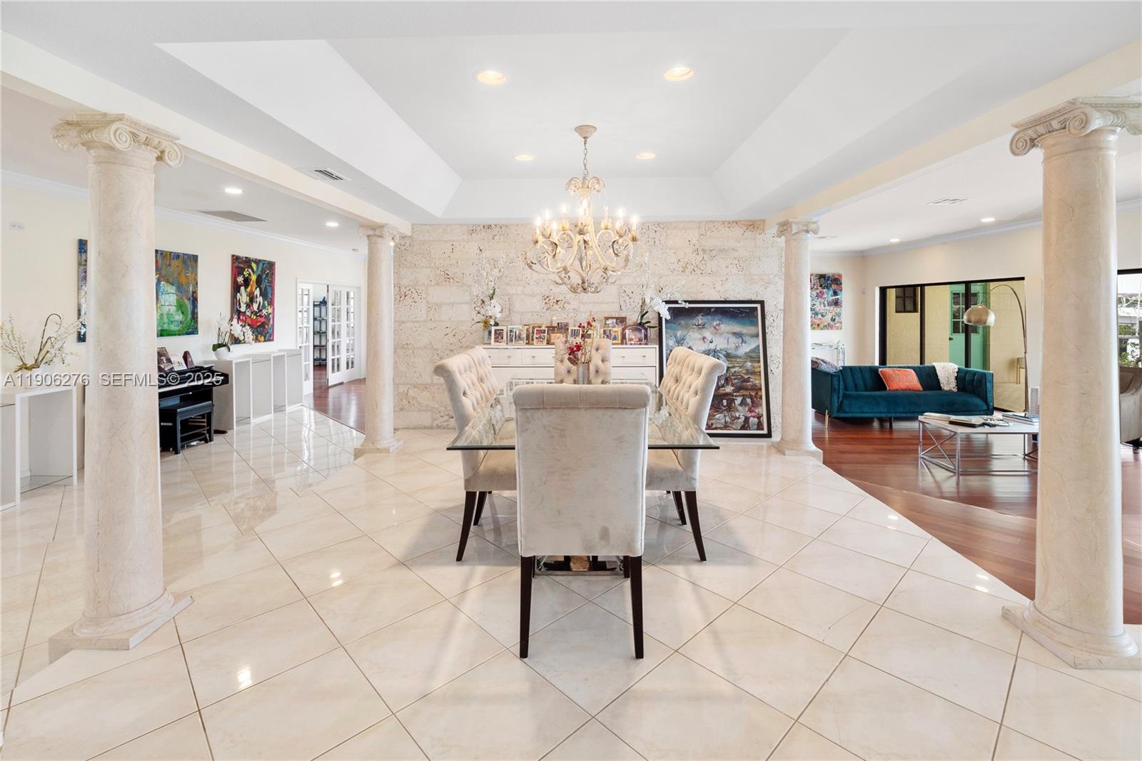 1635 Lands End Road Manalapan, FL 33462 - Photo 17 of 38 a dining room well furnished with furniture a chandelier and kitchen view