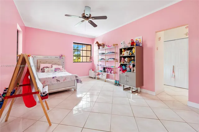 a bedroom with furniture and a chandelier