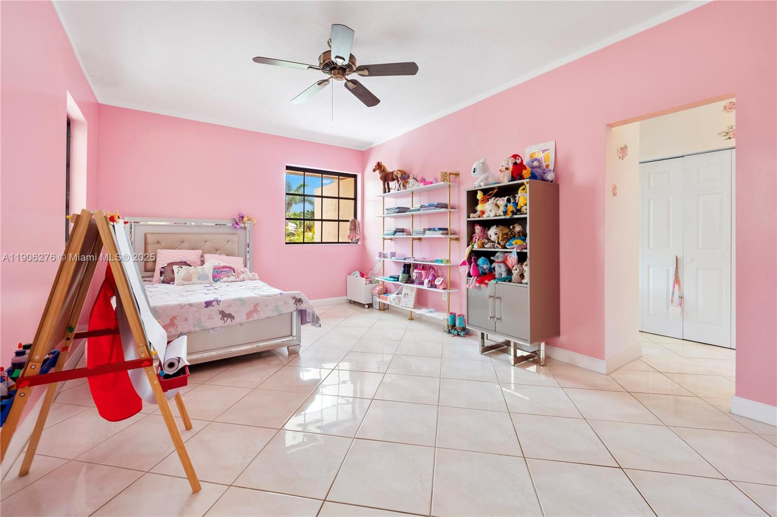 1635 Lands End Road Manalapan, FL 33462 - Photo 18 of 38 a bedroom with furniture and a chandelier