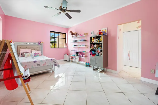 a bedroom with furniture and a window