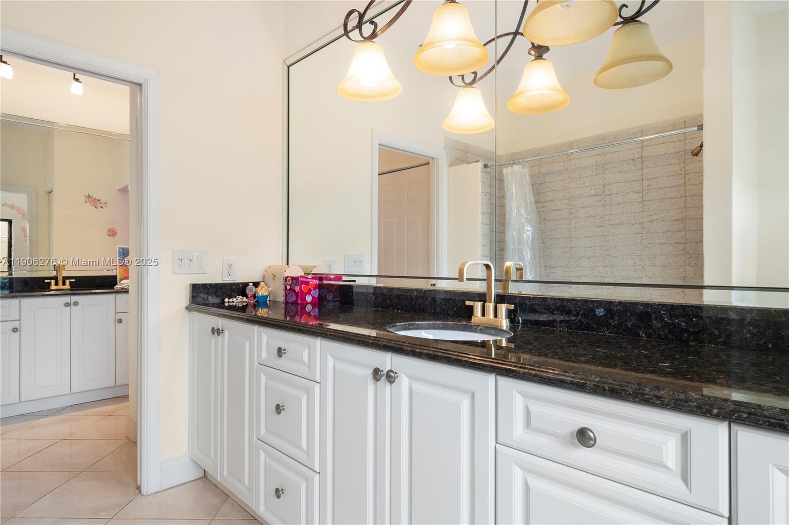 1635 Lands End Road Manalapan, FL 33462 - Photo 20 of 38 a bathroom with a sink and a mirror