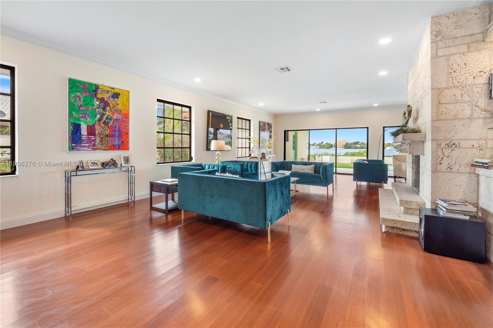 1635 Lands End Road Manalapan, FL 33462 - Photo 24 of 38 a living room with furniture and a wooden floor