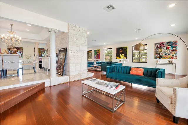 a living room with furniture and a table