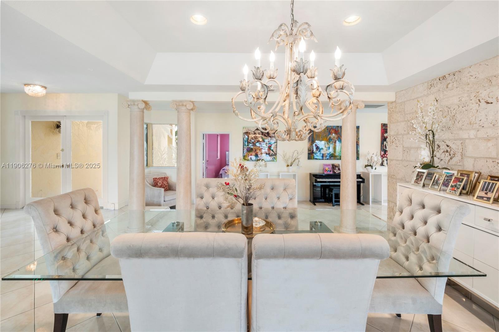 1635 Lands End Road Manalapan, FL 33462 - Photo 32 of 38 a living room with furniture and a chandelier