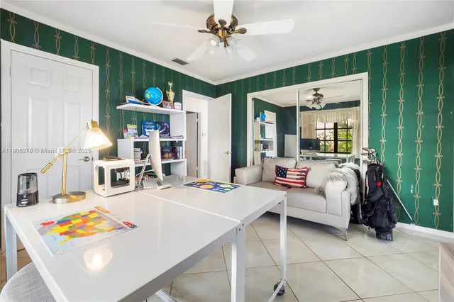 a living room with lots of furniture and a chandelier