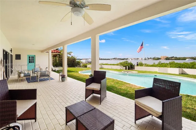 a view of a patio with swimming pool