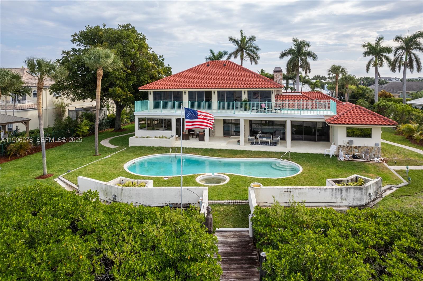 1635 Lands End Road Manalapan, FL 33462 - Photo 5 of 38 an aerial view of a house with swimming pool patio and outdoor seating