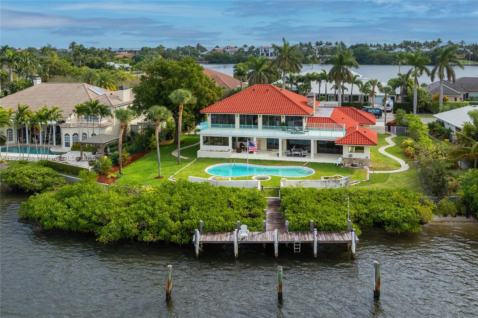 1635 Lands End Road Manalapan, FL 33462 - Photo 6 of 38 an aerial view of a house with a garden and a yard