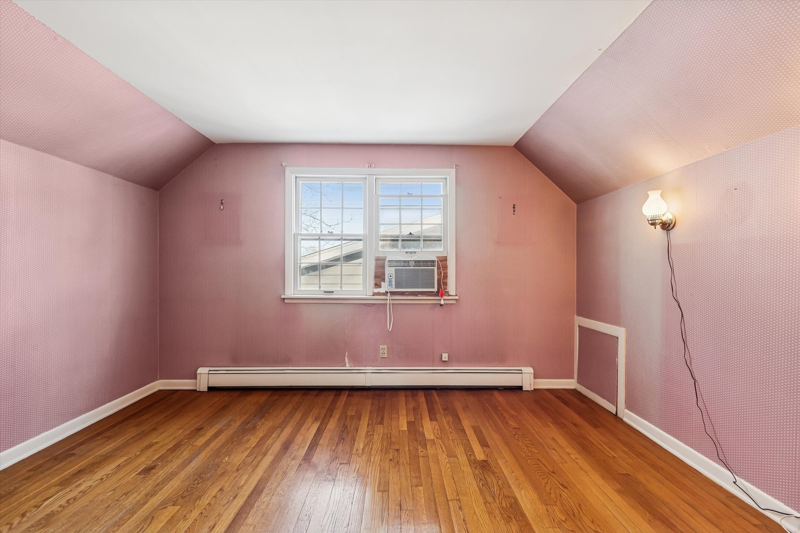 47 Sunset Drive Cary, IL 60013 - Photo 11 of 19 a view of an empty room with wooden floor and a window