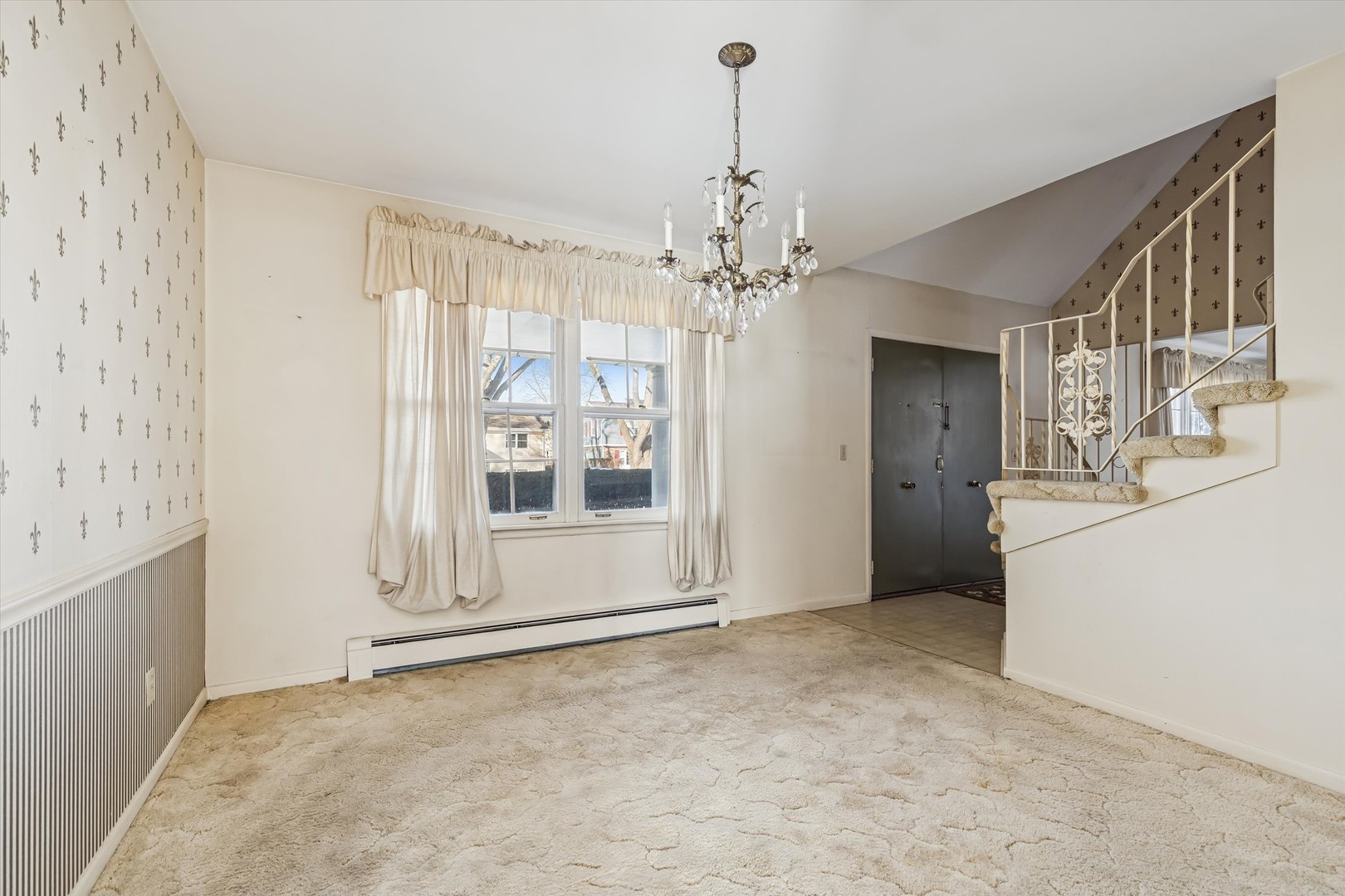 47 Sunset Drive Cary, IL 60013 - Photo 3 of 19 a view of a livingroom with a chandelier