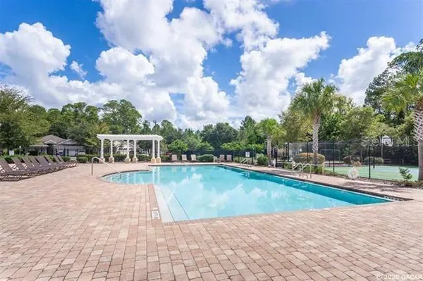 a view of a swimming pool with a patio