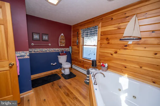 a bathroom with a toilet and a sink