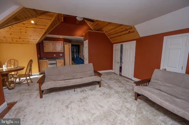 a view of a park with iron fence