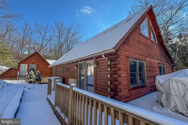 a view of a house with wooden deck