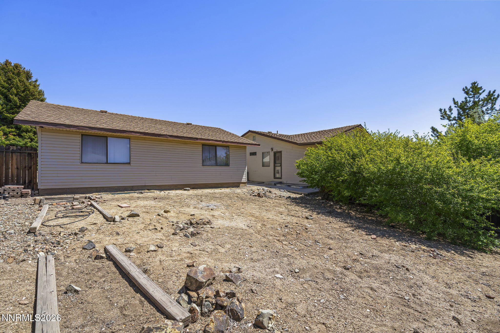 2985 Socrates Drive Reno, NV 89512 - Photo 27 of 52 a front view of a house with a yard