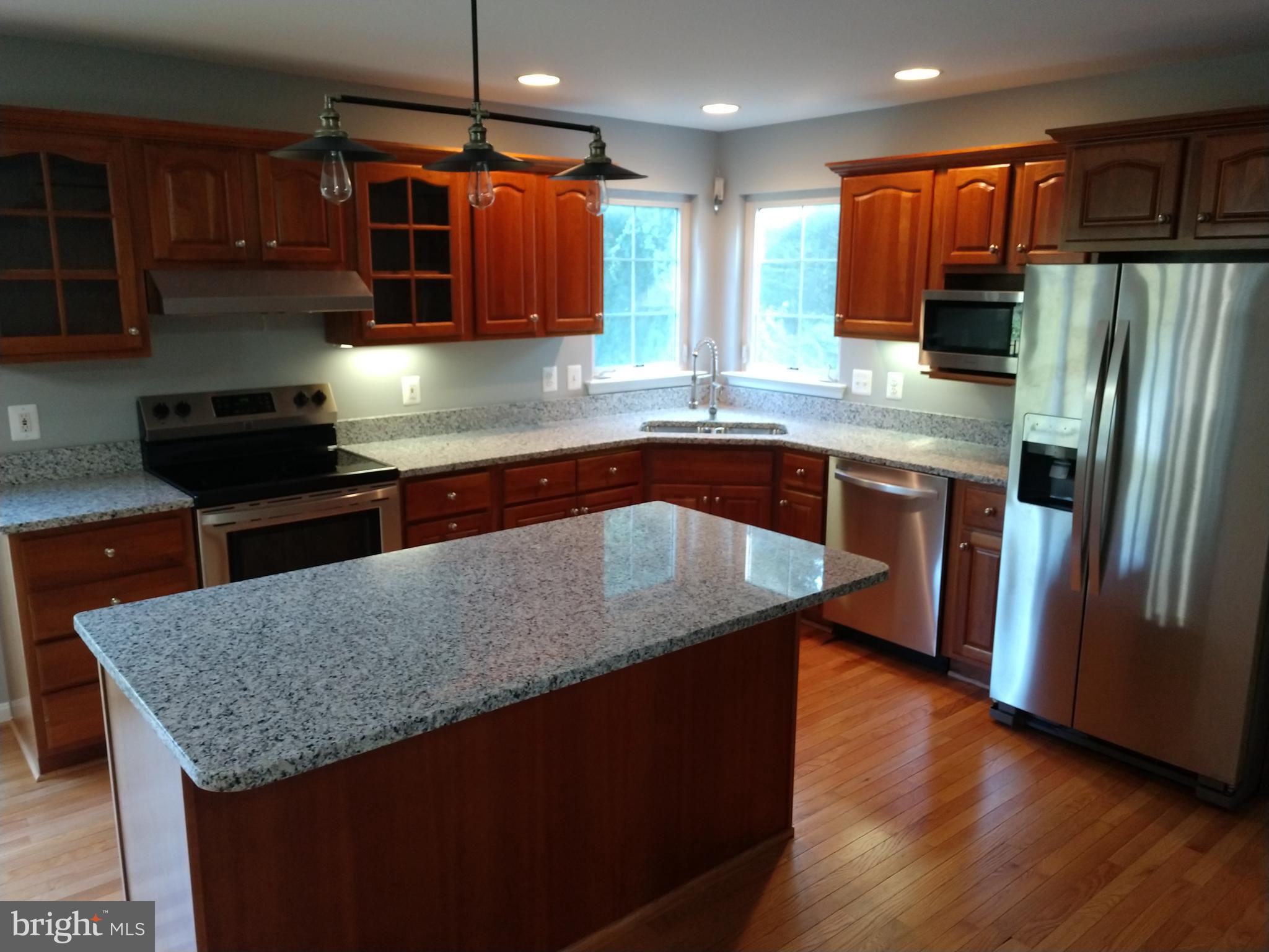 Granite countertops.  Stainless Steel appliances.