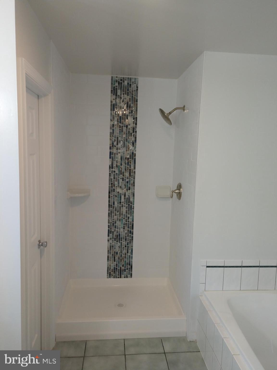 Custom tile work in master shower.