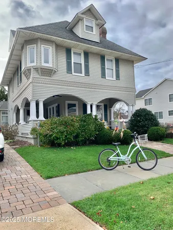a front view of a house with a yard table and chairs
