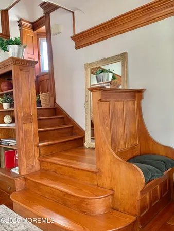 a view of staircase with a rug