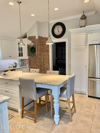 a kitchen with a table and chairs in it