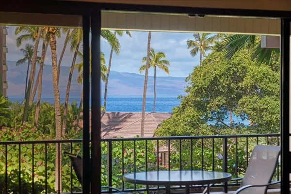 a view of a balcony with wooden floor