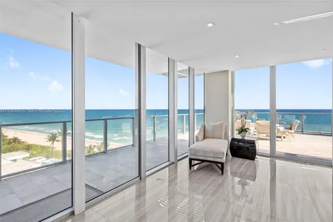 a view of a swimming pool with chairs