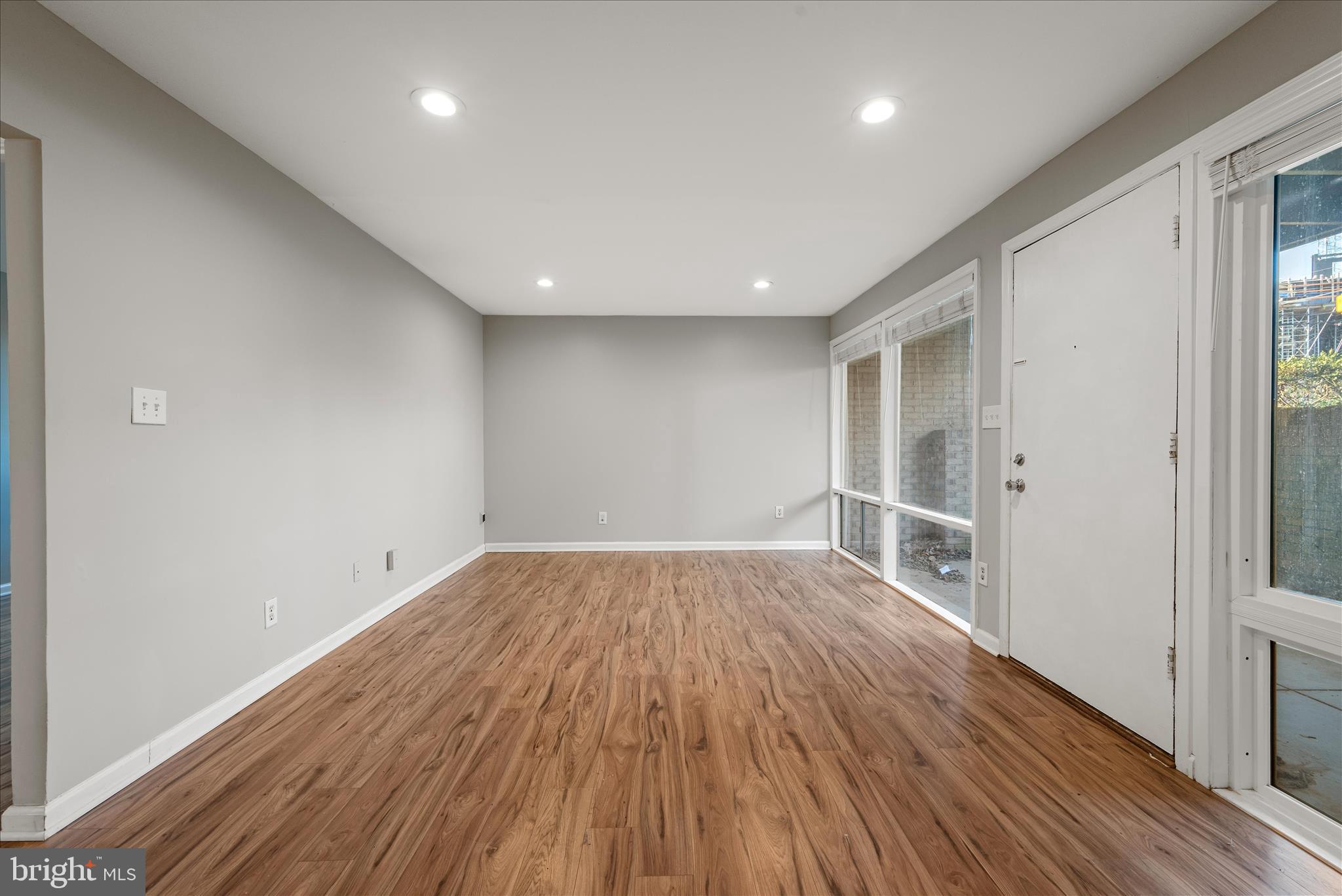 156 Haycock Road, Unit A6 Falls Church, VA 22046 - Photo 20 of 30 wooden floor in an empty room with a window