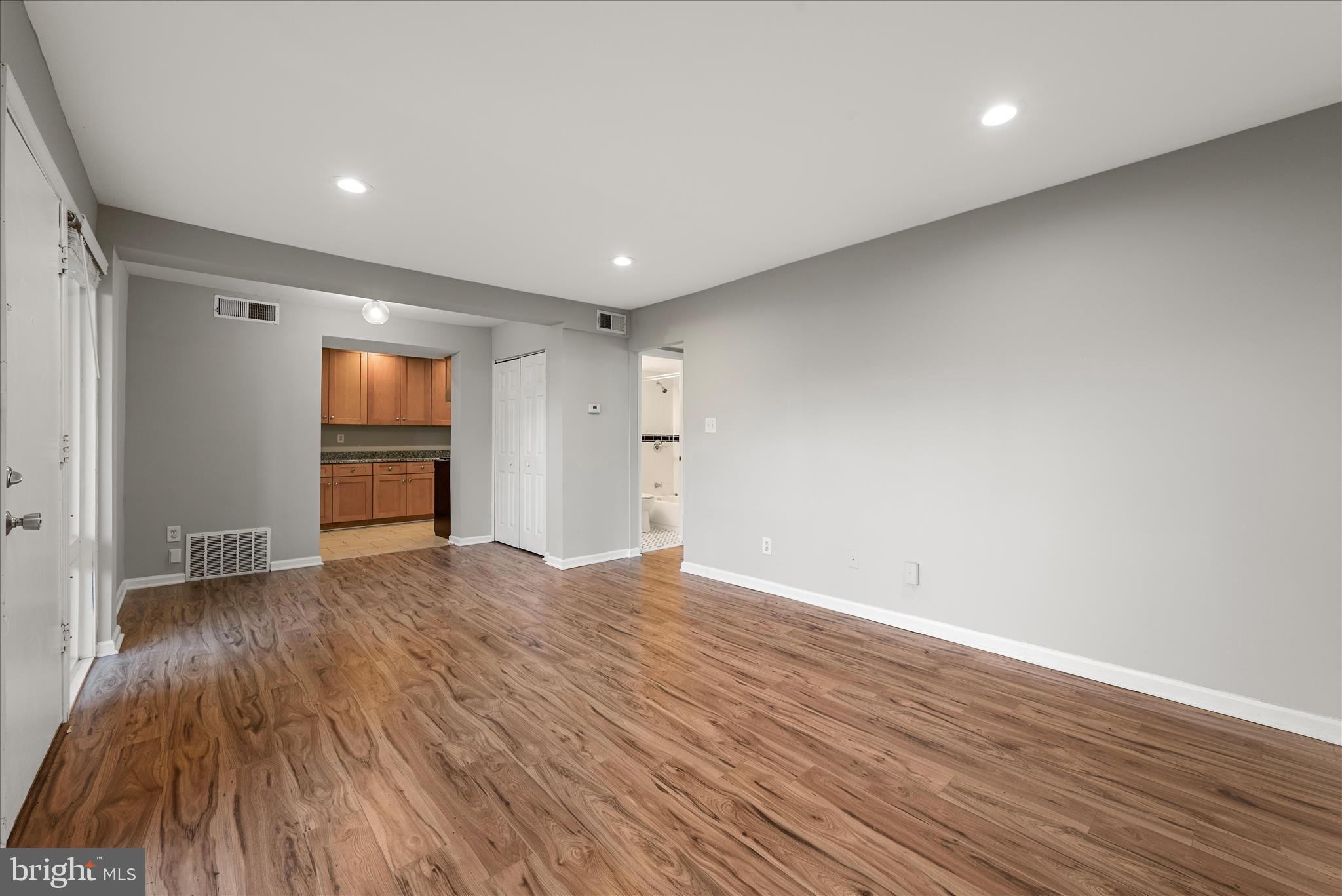 156 Haycock Road, Unit A6 Falls Church, VA 22046 - Photo 22 of 30 a view of empty room with wooden floor and fan