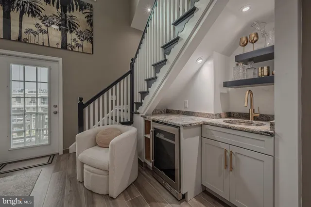 a living room with furniture a stove and a window