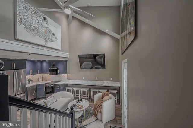 a view of a hallway with seating area