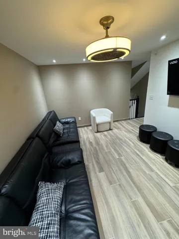 a bedroom with bed and wooden floor