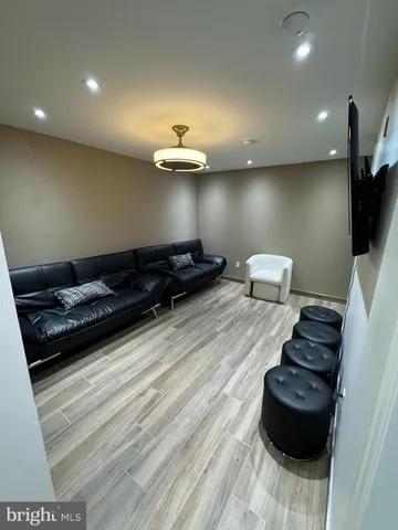 a living room with furniture and a mirror