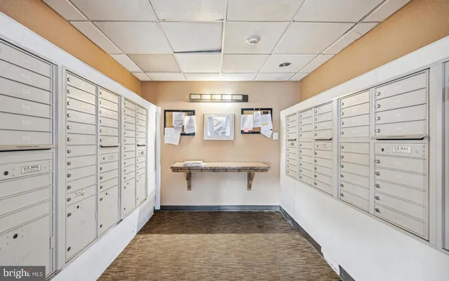 a view of a room with wooden floor and furniture