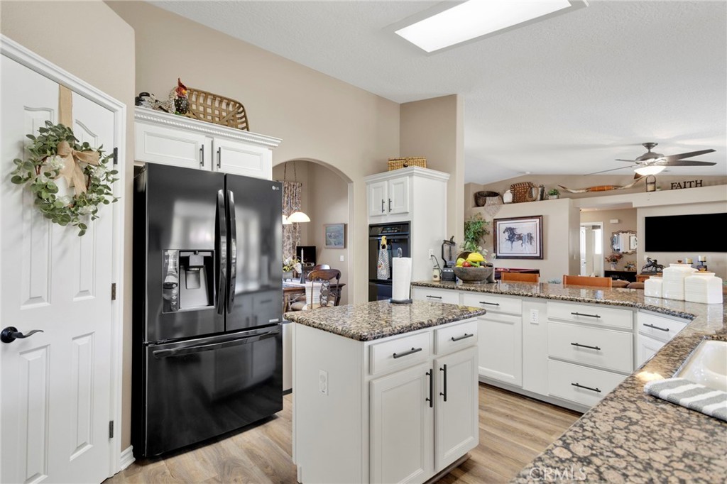 2909 Silver Ridge Drive Pinon Hills, CA 92372 - Photo 15 of 55 a kitchen with stainless steel appliances granite countertop a sink and cabinets