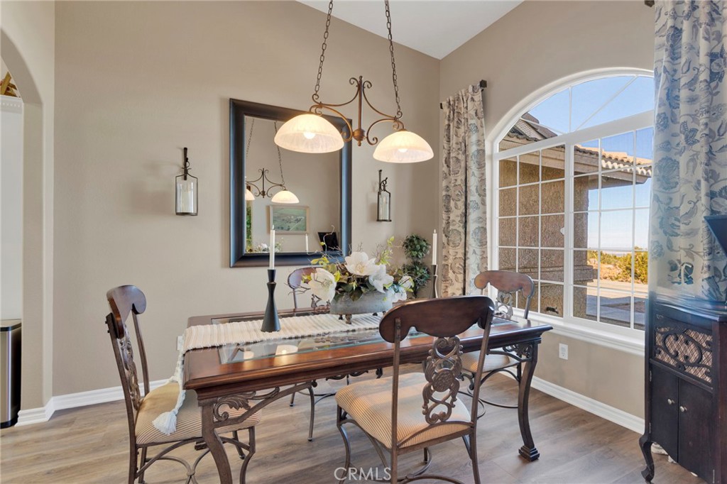 2909 Silver Ridge Drive Pinon Hills, CA 92372 - Photo 17 of 55 a view of a dining room with furniture and a large window