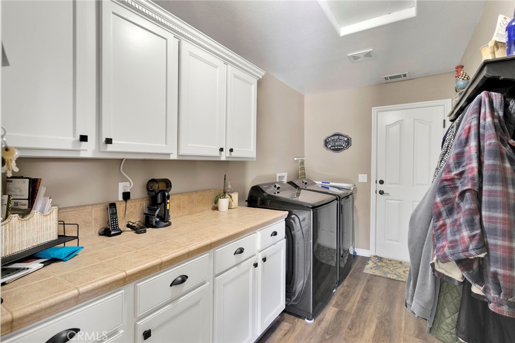 2909 Silver Ridge Drive Pinon Hills, CA 92372 - Photo 18 of 55 a kitchen with a sink and cabinets