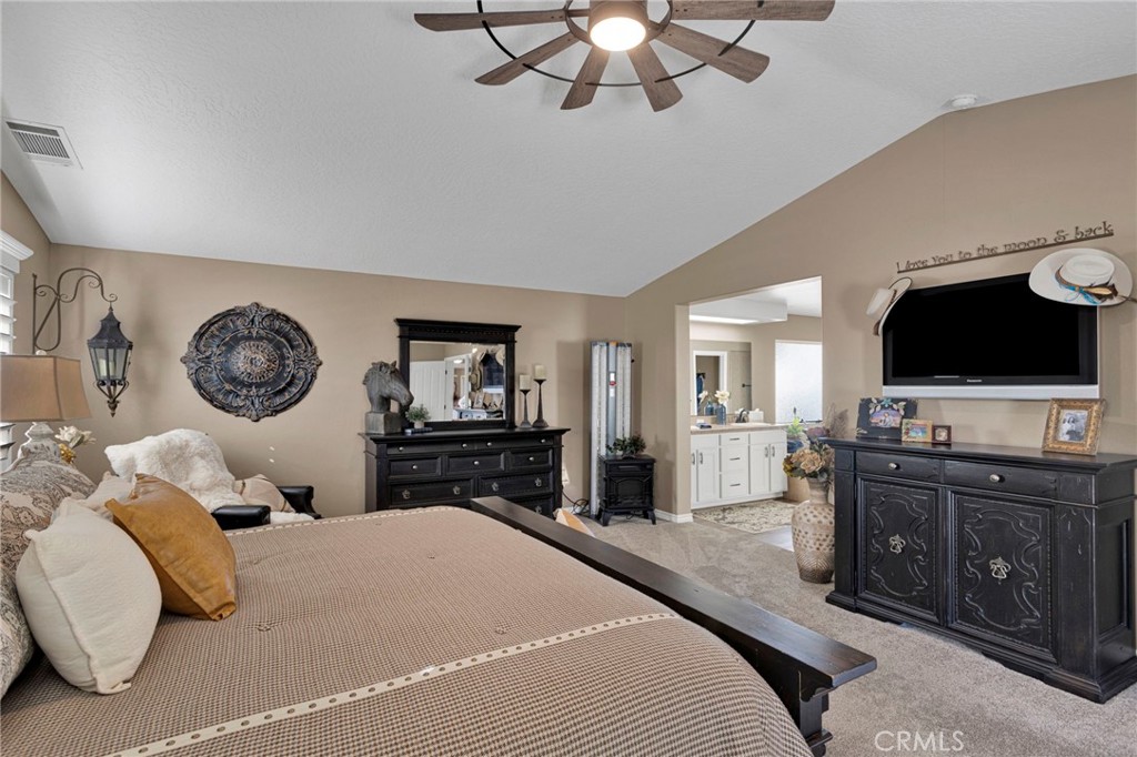 2909 Silver Ridge Drive Pinon Hills, CA 92372 - Photo 20 of 55 a bedroom with a bed and a flat screen tv