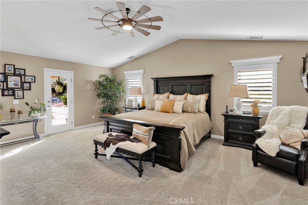 2909 Silver Ridge Drive Pinon Hills, CA 92372 - Photo 21 of 55 a bedroom with a bed a chair and potted plant on the dresser