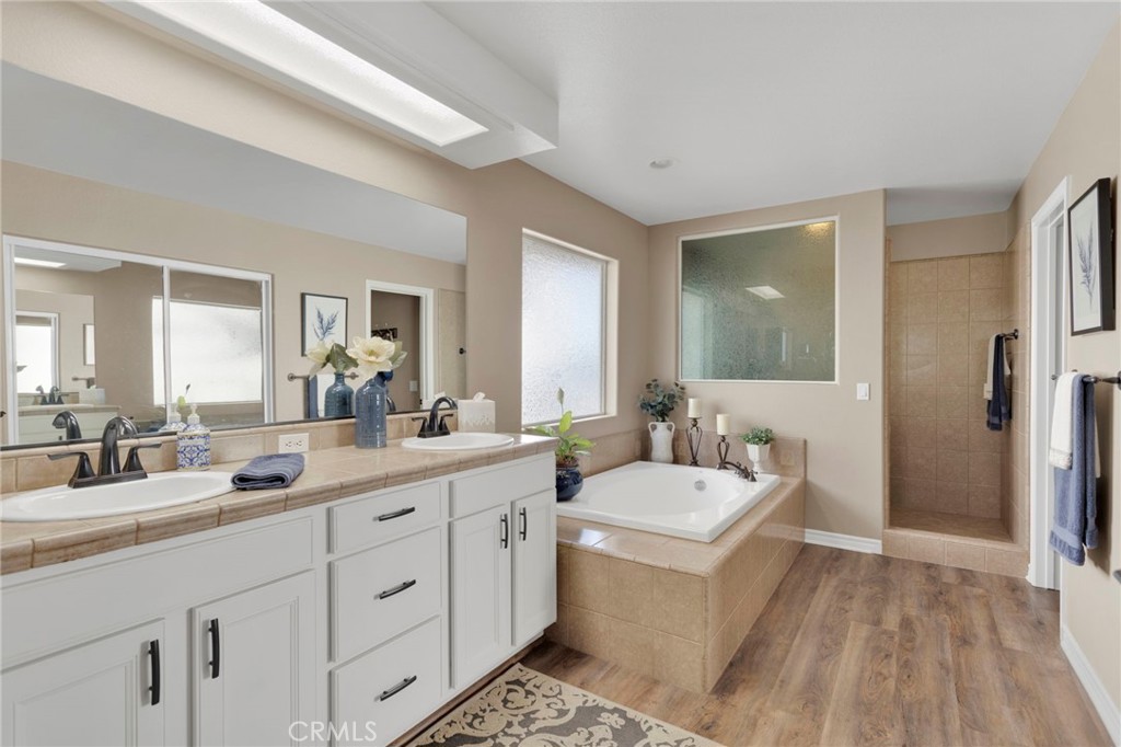 2909 Silver Ridge Drive Pinon Hills, CA 92372 - Photo 22 of 55 a bathroom with a sink double vanity granite and a mirror