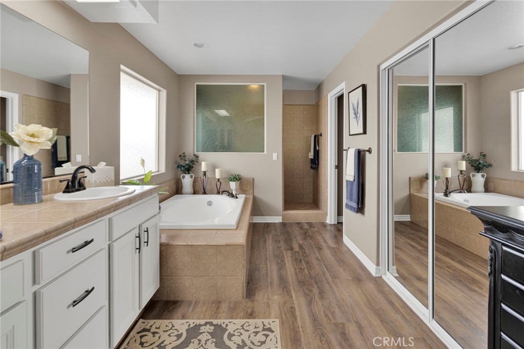 2909 Silver Ridge Drive Pinon Hills, CA 92372 - Photo 23 of 55 a bathroom with a sink a mirror and a shower