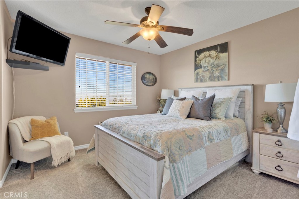 2909 Silver Ridge Drive Pinon Hills, CA 92372 - Photo 25 of 55 a bedroom with a bed and a flat screen tv